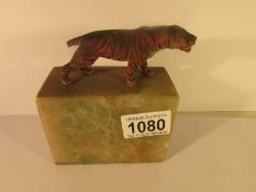 A painted metal tiger on marble base (tail a/f)
