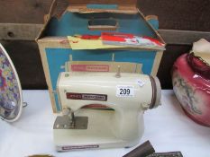 A vintage boxed Jones Meccano sewing machine