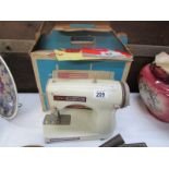 A vintage boxed Jones Meccano sewing machine