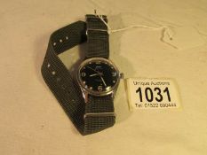 A HM1 Jawan Indian military style wrist watch featuring war department stamp,