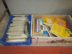 A box of books on France and maps together with a tray of postcards including foreign