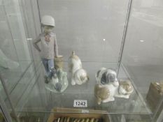 A NAO figure of a boy with dog,