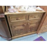 A pine 2 drawer 2 door cupboard
