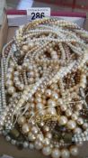 A large quantity of pearl necklaces.