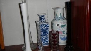 5 glass and 2 ceramic vases.