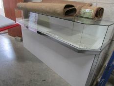 A large glazed shop display counter.