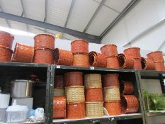 A large quantity of wicker planters.