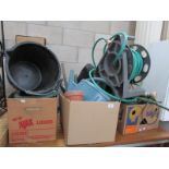 A mixed lot of garden items including hose pipe, watering can etc.