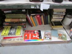 A mixed lot of books including sport related.