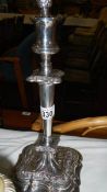 A silver plated candlestick,