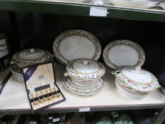 A shelf of dinner ware, some a/f.