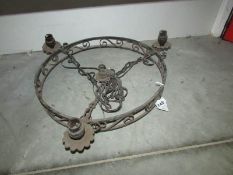 A wrought iron ceiling light,.