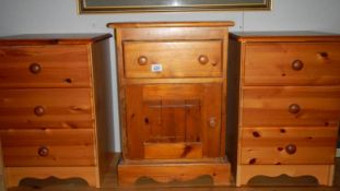 A pair of pine 3 drawer bedside chests and a pine bedside cabinet.