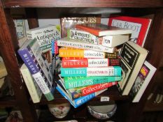 A shelf of antique reference books.