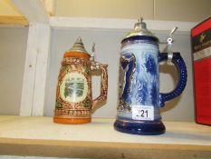 2 lidded beer steins.