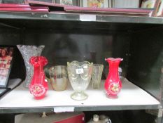 A shelf of glass vases.