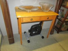 A 2 drawer pine side table.