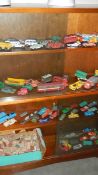 A large quantity of play worn die cast and a box of wooden building bricks.