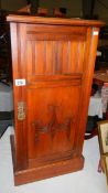 A mahogany pot cupboard.