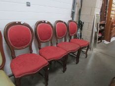 A set of 4 mahogany framed chairs with brocade upholstery.