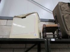 A linen bin and a stool.