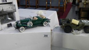 A Danbury Mint WW2 jeep and 1932 Cadillac.