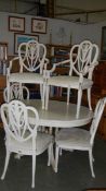 A painted dining table and 6 chairs,.