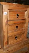 A pine 3 drawer bedside chest.