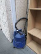 An industrial type vacuum cleaner.