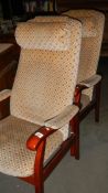 A pair of arm chairs,