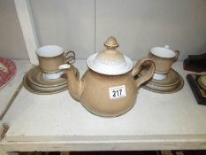 A teapot and 2 trios.