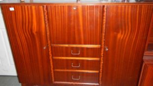 A mahogany bureau/cabinet.
