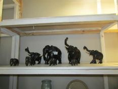 8 old carved hard wood elephants, some a/f.