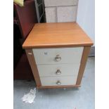 A 3 drawer bedside chest.