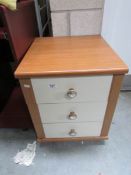 A 3 drawer bedside chest.