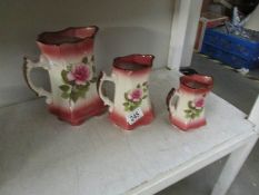 A set of 3 graduated jugs.