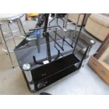 A black glass television stand,