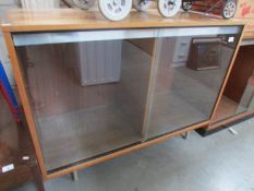 A sliding door cabinet.