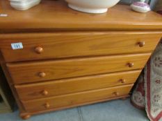 A modern pine 4 drawer chest.