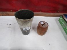 A horn cup and an old money box.