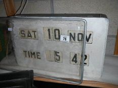 A vintage digital flipcard calendar wall clock