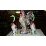 An Italian cockerel and a pair of porcelain mallards.