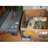 A circular bench saw and a box of screws etc.