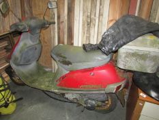 An old scooter and leathers.