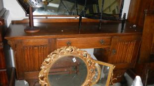 A Priory style oak wardrobe, dressing table and headboard.