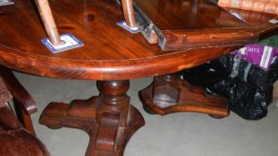 A double pedestal mahogany extending dining table.