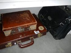 A small vintage suitcase and 2 briefcases,