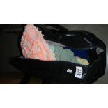 A bag of hand knitted hats.
