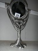 A figural mirror.