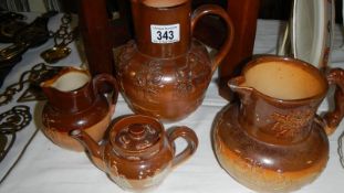 3 Doulton stoneware jugs and a teapot, a/f.